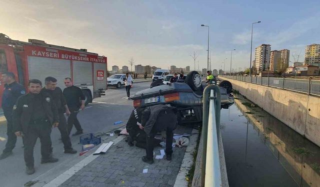 Takla atan otomobil kanala düşmeden son anda durdu: 1 yaralı